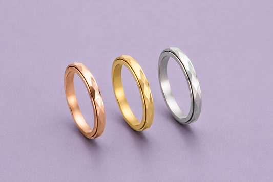 Calm Wave stainless steel fidget ring with rippled spinning band in four finishes