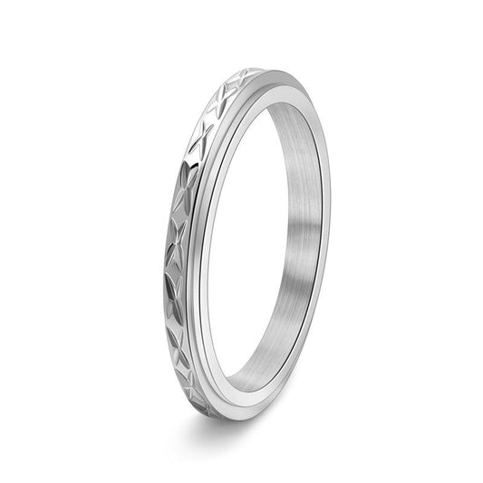 Dainty anxiety ring in silver with faceted spinning band on white background