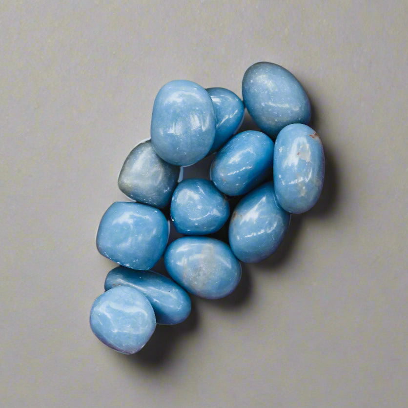 Angelite Tumbled Stone 1 inch, polished blue healing crystal for peace and anxiety relief, calming angelite gemstone for stress and emotional healing, natural angelite pocket stone for meditation and mindfulness, angelite crystal for compassion and clear communication, genuine angelite stone for spiritual growth and angel connection, tumbled gemstone for self-care and chakra healing, angelite crystal gift for women and men