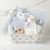 Bundle of Joy Baby Boy Gift Basket – Includes cotton knit sweater, matching hat, cozy blanket, wooden cloud teether, baby lotion, baby wash, lovie, and keepsake cloud base. Ideal for baby showers, newborn gifts, and personalized baby gifts in blue, pink, or grey.