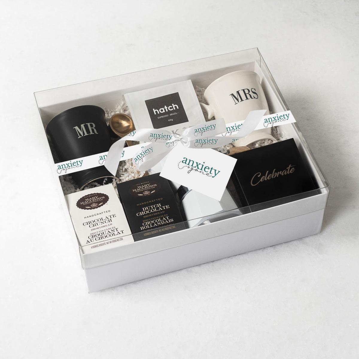 Celebrate Love Gift Box featuring self-care items like Mr. & Mrs. mugs, espresso coffee maker, gourmet treats, and more—ideal for engagement gifts, anniversary presents, thank you gift baskets, and self-care gift baskets.