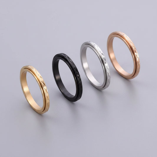 Thing fidget ring in silver, gold, black and rose gold finishes side by side
