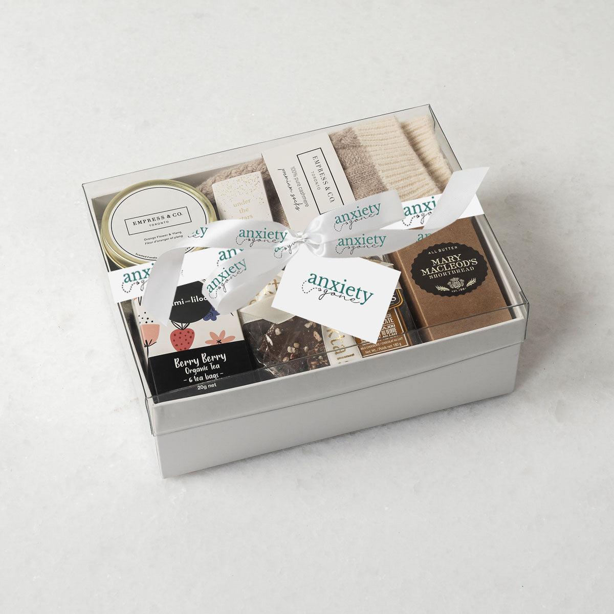 Simply the Best Gift Box featuring luxurious self-care items like milk chocolate, shortbread cookies, a scented candle, cashmere socks, and more—ideal for self-care gifts, thank you gift baskets, and mental health gifts.