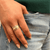 Sterling Silver Fidget Ring for men and women with Yellow Gold and Rose Gold spinning bands, displayed with complimentary MeditationRings Tin and Travel Pouch