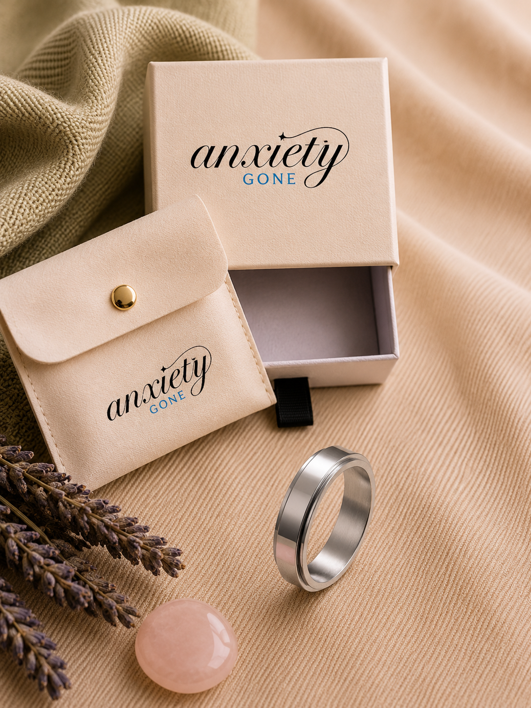 Flux Polished Band Spinner Ring displayed with its Anxiety Gone gift box and pouch