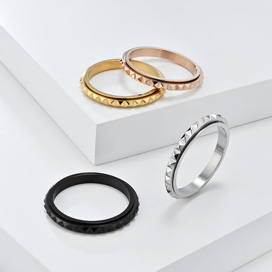 Overcome Black Geometric Fidget Ring displayed with its Anxiety Gone gift box and pouch