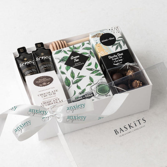 Just Tea & Me Wellness Gift Box – A beautifully curated tea gift box featuring chai tea, cookies, chocolate, and honey for the ultimate self-care experience in a food gift basket. 

