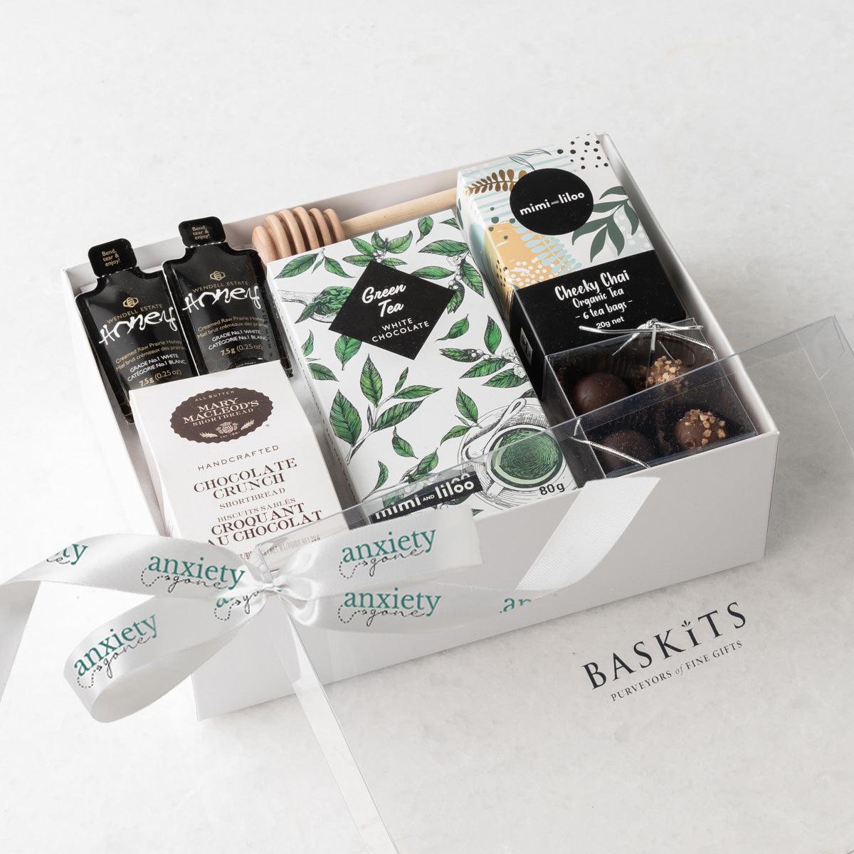 Just Tea & Me Wellness Gift Box – A beautifully curated tea gift box featuring chai tea, cookies, chocolate, and honey for the ultimate self-care experience in a food gift basket. 

