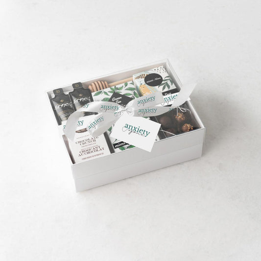 Just Tea & Me Wellness Gift Box – A beautifully curated tea gift box featuring chai tea, cookies, chocolate, and honey for the ultimate self-care experience in a food gift basket. 

