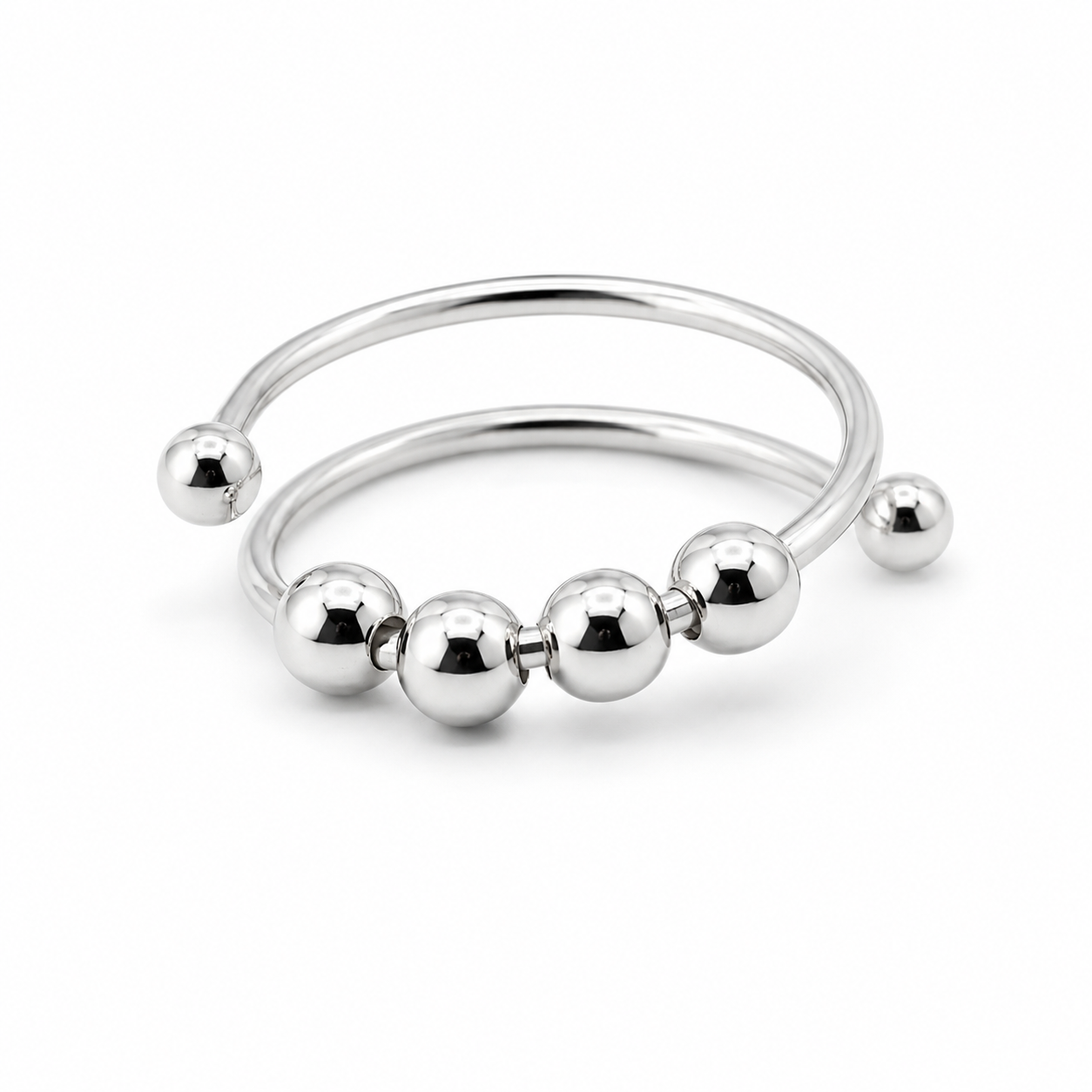 A polished silver-tone metal fidget ring with five evenly spaced spherical beads, shown on a clean white background.