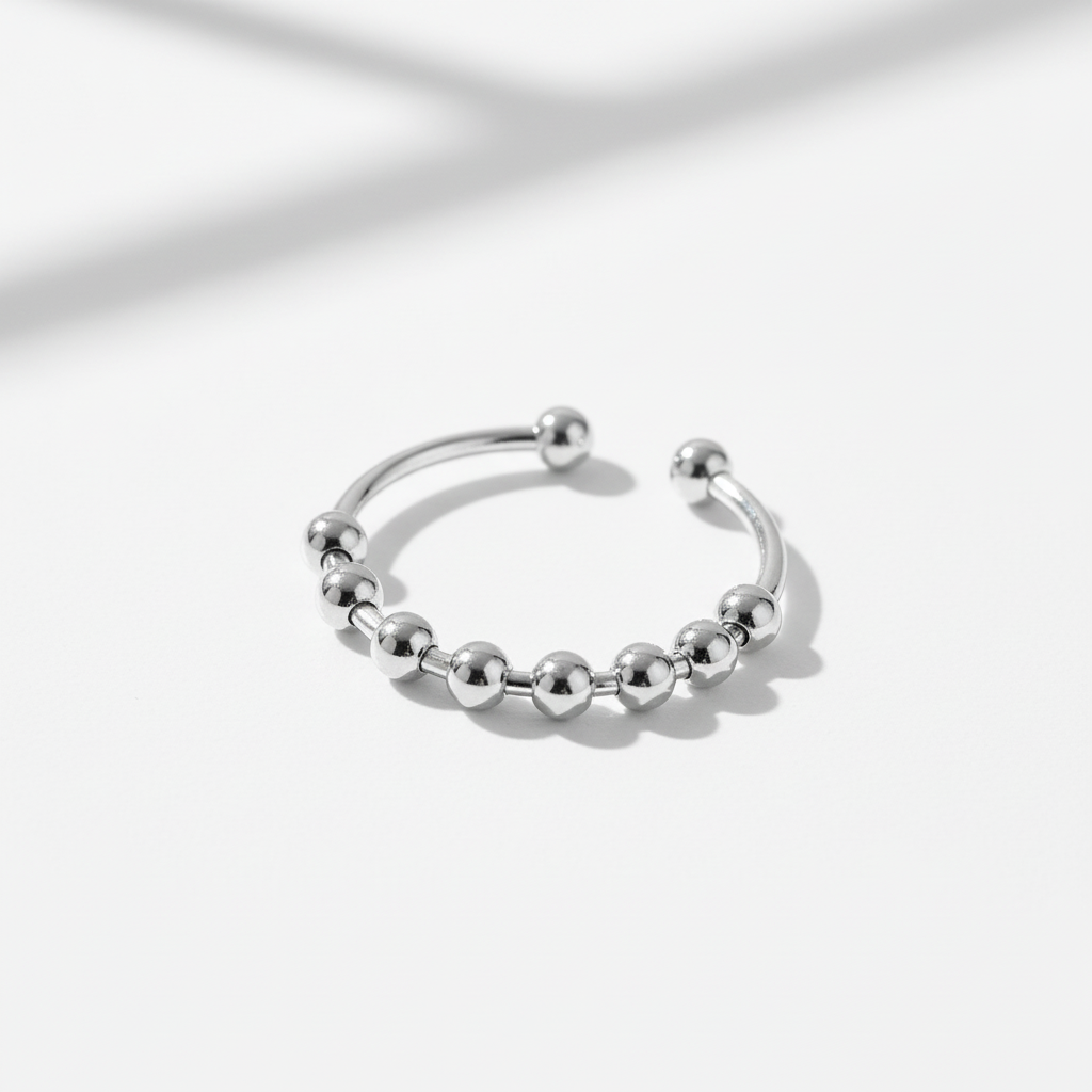 fidget ring, anxiety ring, spinner ring, worry ring, fidget jewelry, fidget ring for anxiety, spinning anxiety ring, anti-anxiety ring, stress relief ring, fidget ring for stress, fidget ring for adults, fidget ring for kids, fidget ring for women, fidget ring for men, discreet fidget ring, fidget ring for focus, fidget ring for work, calming ring for anxiety, ring to reduce stress, mental health support jewelry, stainless steel fidget ring, sterling silver fidget ring, gold spinner ring, minimalist fidget 