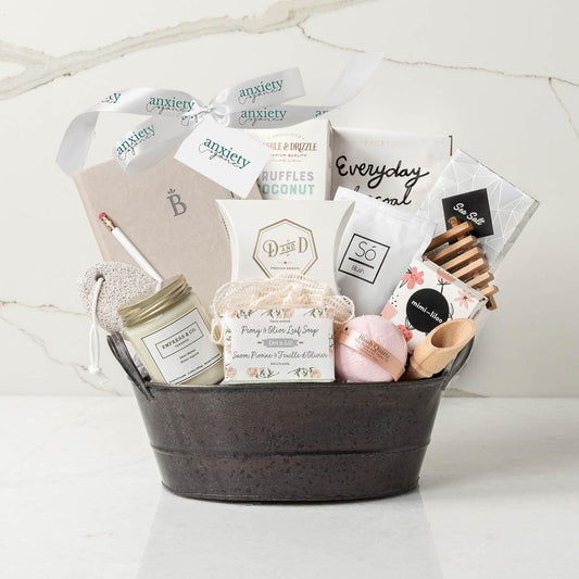 Luxury self-care gift basket for women with bath salts, chocolates, and spa products is a Wellness gift basket for relaxation and pampering