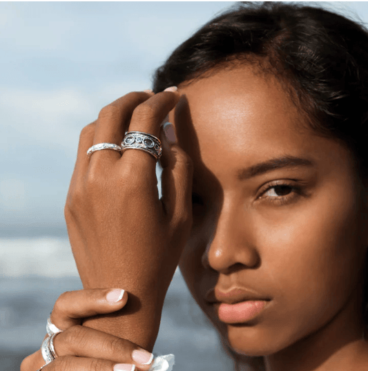 Sky Crystal  Fidget Ring worn on a hand of a woman