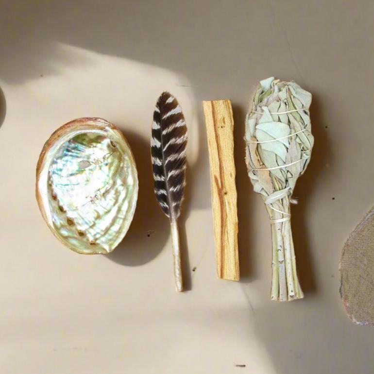 Beginner's Mini Smudging Kit with abalone shell, smudge stick, palo santo, and feather for energy cleansing, spiritual healing, and anxiety relief