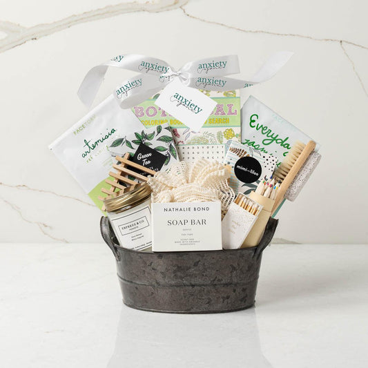 Luxury spa day gift basket for women with skincare, candles, and chocolates is a Self-care gift set with tea, soap, bath pouf, and beauty products