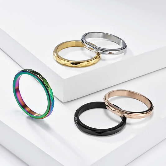 Calm Wave stainless steel fidget ring with rippled spinning band in five finishes