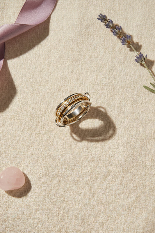 Mixed metal meditation ring with gold and silver linked bands