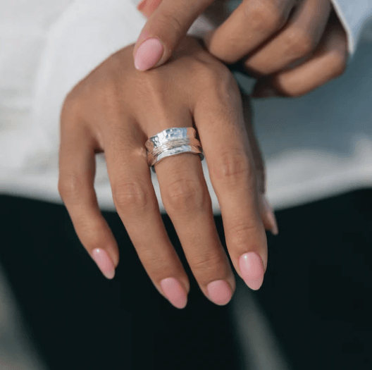 Sterling Silver Meditation Ring with thick Yellow Gold spinning band and scalloped edges, displayed with complimentary MeditationRings Tin and Travel Pouch
