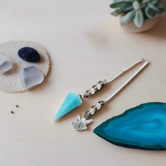 angelite pendulum, angelite crystal pendulum, pendulum with angel chain, angelite dowsing pendulum, healing crystal pendulum, angelite pendulum necklace, divination pendulum angelite, angel pendulum crystal, crystal pendulum with angel charm
