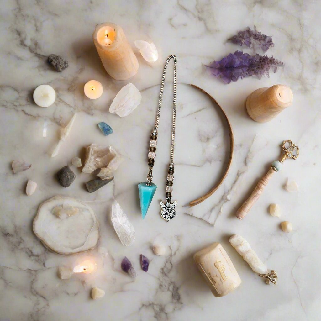 Angelite Pendulum with angel pendant and blue crystal, a self-care gift for mental health and anxiety relief.

