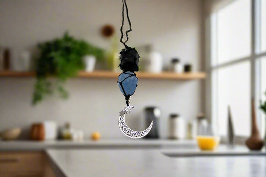 Peaceful Crescent Moon Gemstone Hanging Charm with black tourmaline and celestite, stones for anxiety and inner peace.