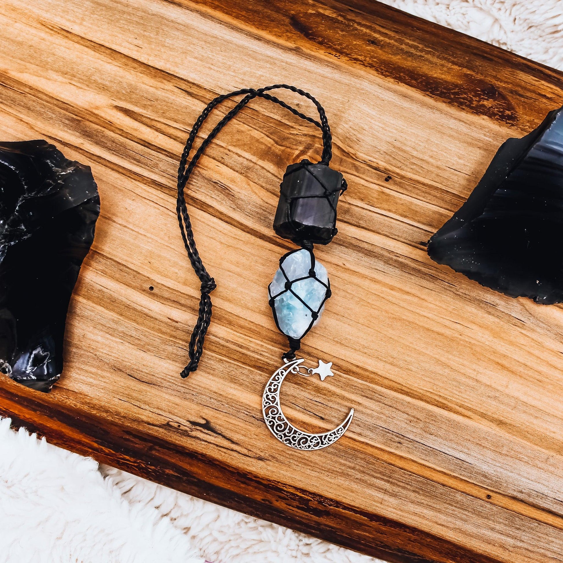 Peaceful Crescent Moon Gemstone Hanging Charm with black tourmaline and celestite, stones for anxiety and inner peace.