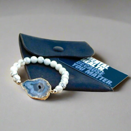 Elevate your style and embrace inner peace with our Soothing Snowy White Howlite Bracelet, crafted to bring calming vibrations to your mind, body, and spirit. This beautiful women's bracelet is made with high-quality white howlite stones, known for their ability to relieve stress, anxiety, and tension. Paired with a stunning agate slab, this bracelet seamlessly blends energy healing and fashion, offering both therapeutic benefits and a chic, versatile accessory for everyday wear.

Whether you’re seeking rel
